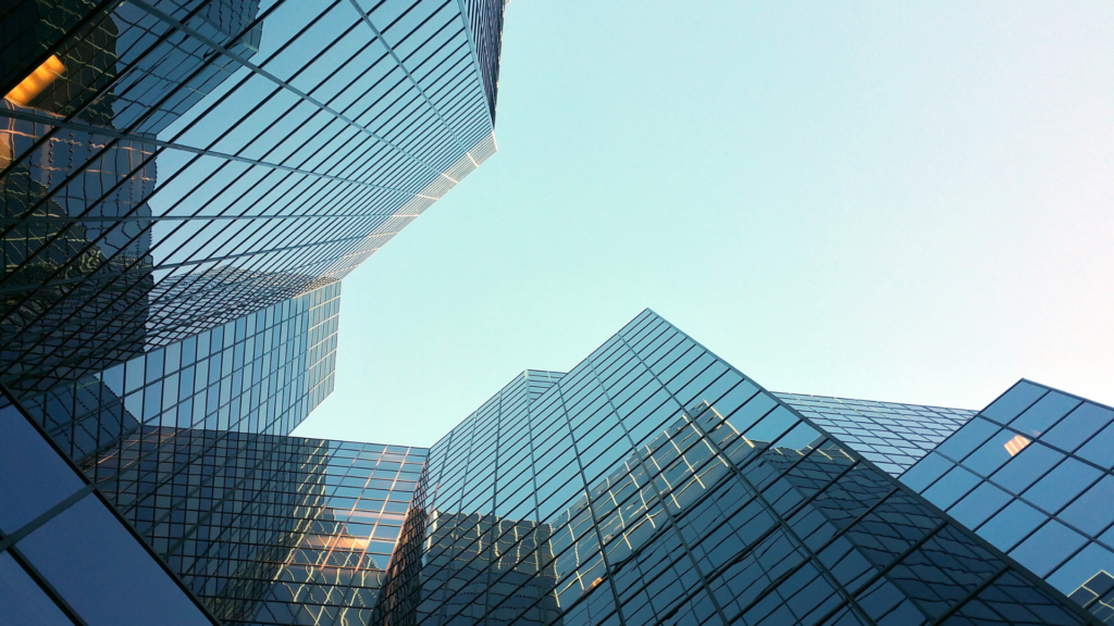 a skyscraper with a blue sky in the background