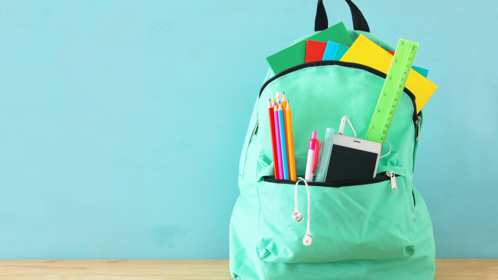 Backpack filled with school supplies.